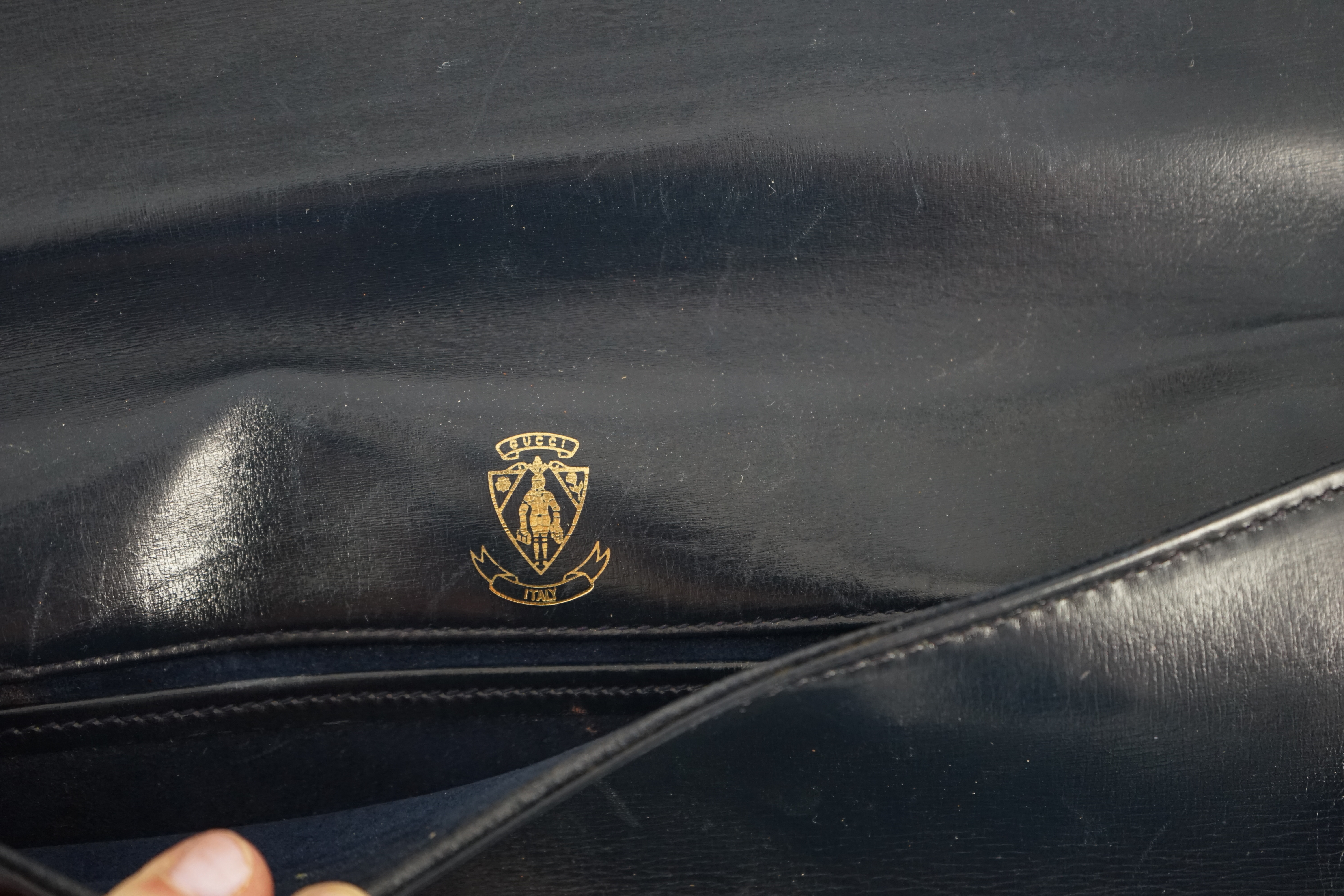 A vintage Gucci Blondie Unicorn navy leather clutch bag, width 28cm, depth 4cm, height 16cm